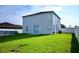 Two-story house with a spacious backyard and an inground pool at 1816 Stargazer Trl, Kissimmee, FL 34758
