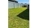 Backyard with grassy area and fence at 1816 Stargazer Trl, Kissimmee, FL 34758