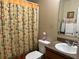 Bathroom with an owl-themed shower curtain at 1816 Stargazer Trl, Kissimmee, FL 34758