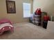 Small bedroom with a pink toddler bed at 1816 Stargazer Trl, Kissimmee, FL 34758