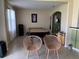 Game room with a pool table and two accent chairs at 1816 Stargazer Trl, Kissimmee, FL 34758