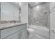 Modern bathroom with gray tile, vanity, and bathtub at 2909 Annalee Rd, St Cloud, FL 34771