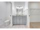 Bathroom with single vanity, toilet, and access to closet at 2909 Annalee Rd, St Cloud, FL 34771