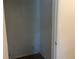 Small empty closet with white walls at 3000 Cashmere Dr, Orlando, FL 32827