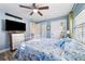 Bright bedroom with a full-size bed, and built-in shelving at 402 Tuscarora St, Lakeland, FL 33805