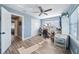 Well-lit bedroom with wood flooring and access to another room at 402 Tuscarora St, Lakeland, FL 33805