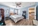Bedroom with a queen bed, and kitchen view at 402 Tuscarora St, Lakeland, FL 33805