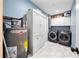 Bright laundry room, featuring washer, dryer, and ample cabinet space at 402 Tuscarora St, Lakeland, FL 33805