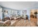 Light and airy living room featuring hardwood floors and neutral-toned furniture at 402 Tuscarora St, Lakeland, FL 33805