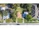 An aerial view of a residential neighborhood, highlighting a single-Gathering home at 402 Tuscarora St, Lakeland, FL 33805