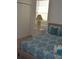 Bedroom with teal bedding and a white dresser at 608 Copeland Dr, Haines City, FL 33844