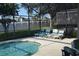 Screened-in pool area with lounge chairs at 608 Copeland Dr, Haines City, FL 33844