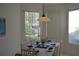 Bright dining room with table set for four and window views at 608 Copeland Dr, Haines City, FL 33844