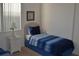 Bedroom with twin-size beds and a nightstand at 608 Copeland Dr, Haines City, FL 33844