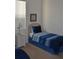 Bedroom with twin-size beds and a nightstand at 608 Copeland Dr, Haines City, FL 33844