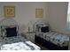 Welcoming bedroom with two twin beds and blue bedding at 608 Copeland Dr, Haines City, FL 33844