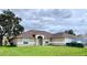 One-story home with attached garage and spacious yard at 324 Baccarat Ct, Kissimmee, FL 34759