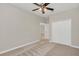 Spacious bedroom featuring a double door closet and carpet flooring at 8972 Azalea Sands Ln # 8972, Davenport, FL 33896