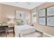 Cozy bedroom with a comfortable bed, desk, and artwork at 3896 Deer Ridge Dr, Mount Dora, FL 32757