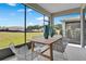 Relaxing screened patio with outdoor dining furniture at 3896 Deer Ridge Dr, Mount Dora, FL 32757