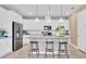 Modern kitchen with white cabinets, gray countertops, and island at 3896 Deer Ridge Dr, Mount Dora, FL 32757