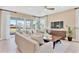 Living room with sliding glass doors leading to backyard, ample seating at 3896 Deer Ridge Dr, Mount Dora, FL 32757