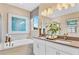 Elegant bathroom with double vanity, soaking tub, and walk-in shower at 3896 Deer Ridge Dr, Mount Dora, FL 32757