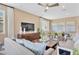 Spacious living room featuring a comfortable sofa and large TV at 3896 Deer Ridge Dr, Mount Dora, FL 32757