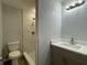 Updated bathroom with a vanity, toilet and shower at 815 S Bay Ave, Sanford, FL 32771