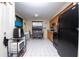 Small kitchen with black appliances and dining area at 725 Michigan Ct # 3, St Cloud, FL 34769