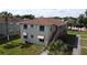 Two-story building with multiple units, stairs, and a partial view of a pool at 725 Michigan Ct # 3, St Cloud, FL 34769