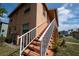 Building exterior with orange steps and white railing at 725 Michigan Ct # 3, St Cloud, FL 34769