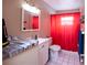 Bathroom with toilet, shower, and vanity at 725 Michigan Ct # 3, St Cloud, FL 34769
