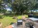 Spacious backyard with patio furniture and fire pit at 1615 Martinsville Ct, Orlando, FL 32825