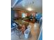 L-shaped kitchen with granite countertops and wood cabinets at 1615 Martinsville Ct, Orlando, FL 32825