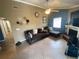 Living room with fireplace, tile floors and a ceiling fan at 1615 Martinsville Ct, Orlando, FL 32825