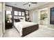 Spacious bedroom with sliding barn door to bathroom at 183 Bull Frog Ln, Umatilla, FL 32784