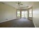 Large bedroom with sliding glass doors leading to patio at 3757 Eagle Isle Cir, Kissimmee, FL 34746