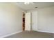 Spacious bedroom with double closets and access to hallway at 3757 Eagle Isle Cir, Kissimmee, FL 34746