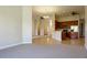 Open concept living room and kitchen with carpeted floors at 3757 Eagle Isle Cir, Kissimmee, FL 34746