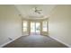 Large bedroom with sliding glass doors leading to patio at 3757 Eagle Isle Cir, Kissimmee, FL 34746