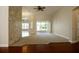 Living room with hardwood and carpeted floors, and access to a lanai at 3757 Eagle Isle Cir, Kissimmee, FL 34746