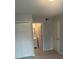 Bedroom with new flooring, double doors leading to bathroom at 9815 Barley Club Dr # Ge, Orlando, FL 32837