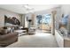 Spacious living room with large TV, comfy seating and access to patio at 1256 S Beach Cir, Kissimmee, FL 34746
