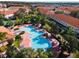 Community pool and surrounding buildings from above at 1256 S Beach Cir, Kissimmee, FL 34746