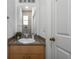Small bathroom with single sink and toilet at 1256 S Beach Cir, Kissimmee, FL 34746