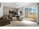 Living room with sliding glass doors to patio at 1256 S Beach Cir, Kissimmee, FL 34746
