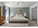 Spacious bedroom with a queen-size bed and lots of natural light at 1256 S Beach Cir, Kissimmee, FL 34746