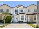 Two story townhome with front yard and driveway at 1256 S Beach Cir, Kissimmee, FL 34746