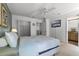 Bedroom with a queen bed, and en-suite bathroom access at 1256 S Beach Cir, Kissimmee, FL 34746